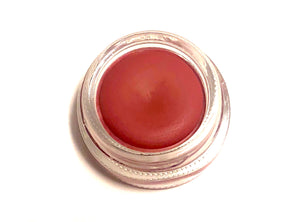 Solomé Beauty’s Lip & Cheek Tint in Scarlet, a bold, fiery red shade in a sleek glass jar, perfect for a vibrant, buildable flush.